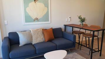 Premium bedding, blackout curtains, soundproofing, iron/ironing board