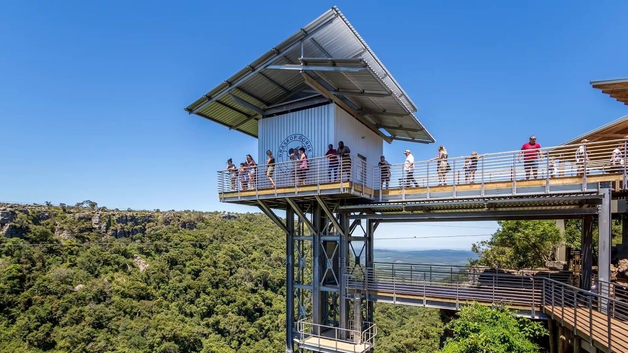 A lookout tower with a metal structure and a platform for visitors.