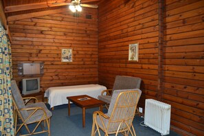 Family Cabin, 2 Bedrooms | Living area | 28-inch TV with satellite channels