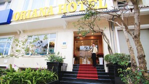 The entrance of the Oriana Hotel with a red carpeted staircase leading up to the door. - Oriana Hotel (Hanoi)