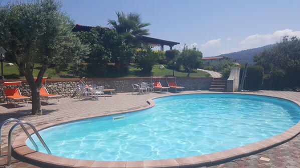 Outdoor pool, pool umbrellas, pool loungers