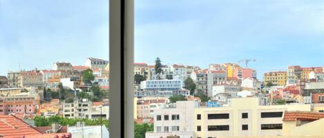 A cityscape with a variety of buildings, including residential and commercial structures.