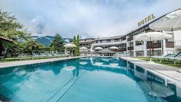 Relax by the pool surrounded by lush surroundings and scenic views.