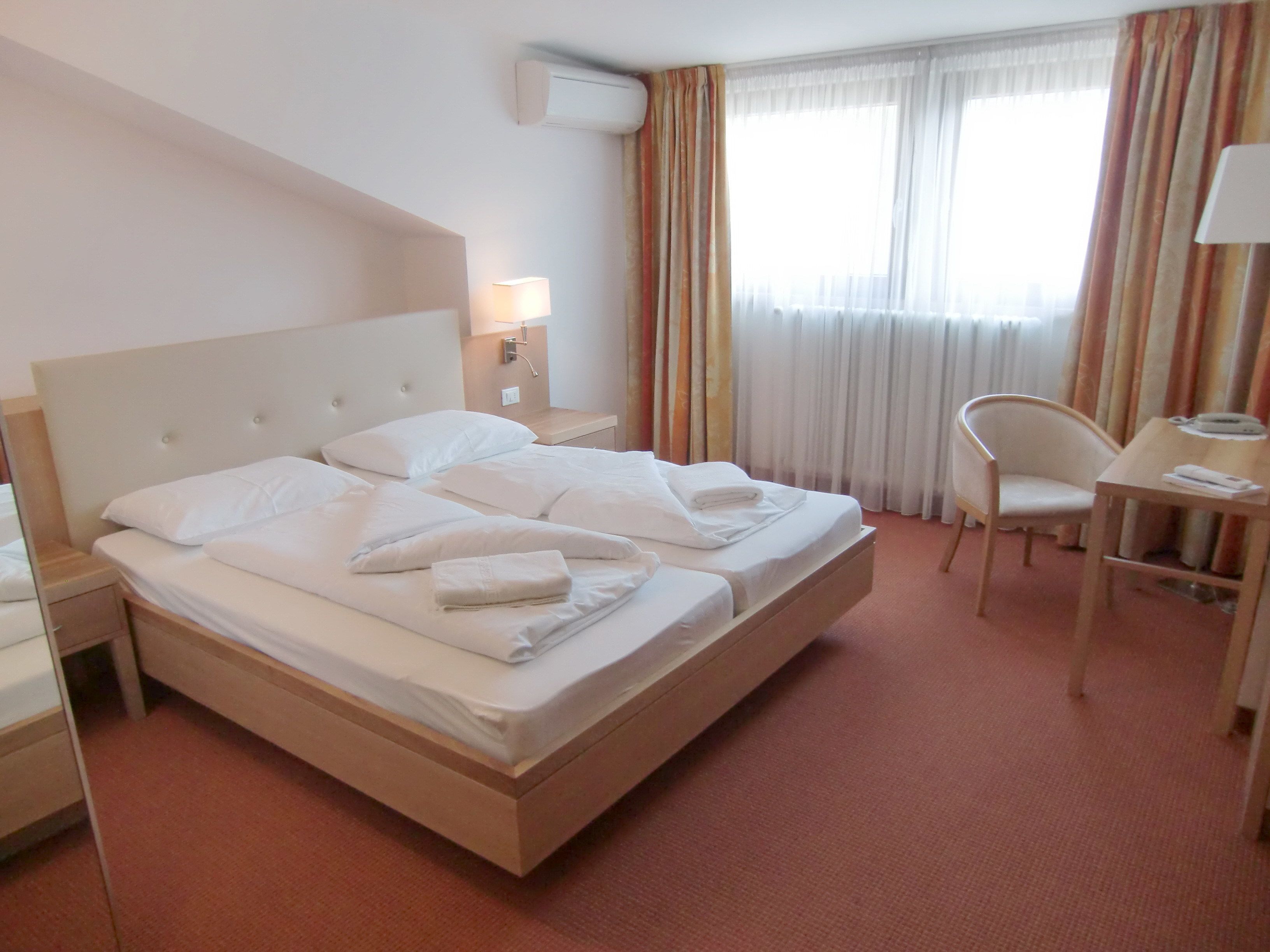 double or twin room | minibar, in-room safe, desk, cots/infant beds