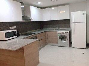 Standard Apartment, 2 Bedrooms, 2 Bathrooms | Private kitchen | Fridge, microwave, oven, electric kettle - Stout Apartments (Manama)