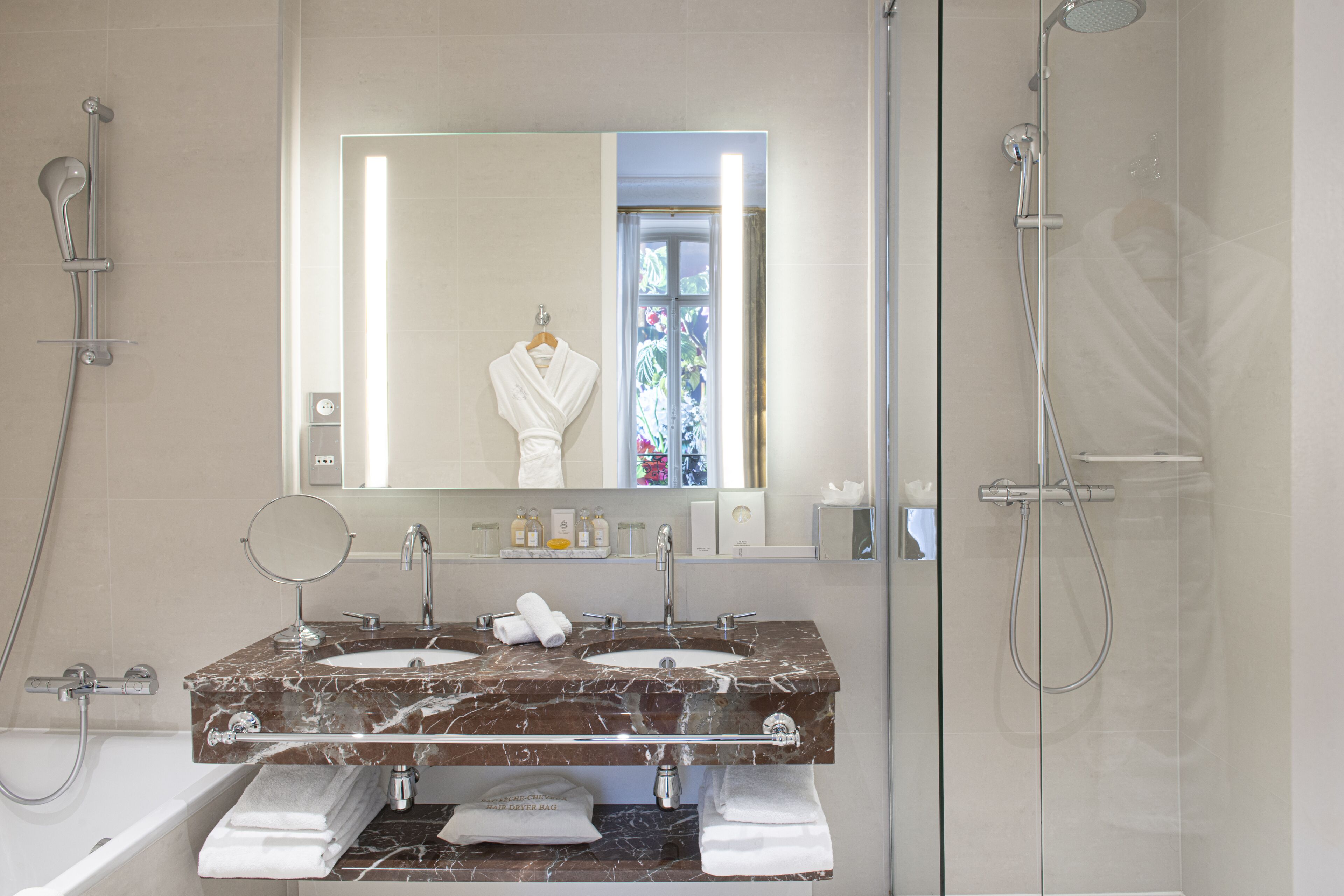 designer toiletries, hair dryer, bathrobes, slippers