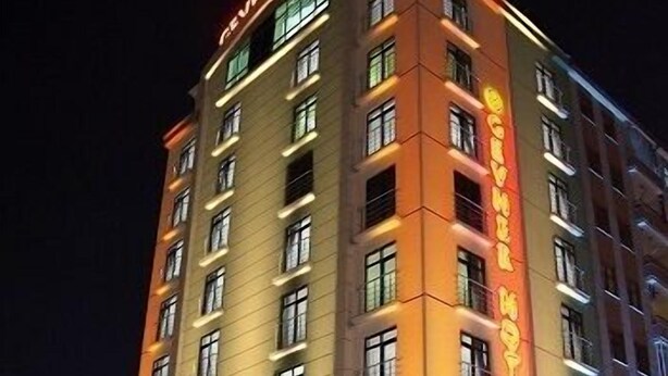 A multi-story hotel with illuminated signage and windows. - Gevher Hotel (Kayseri)