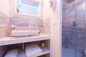 Shower, slippers, bidet, towels