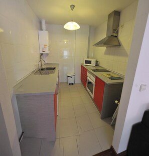 Full-size fridge, microwave, stovetop, coffee/tea maker