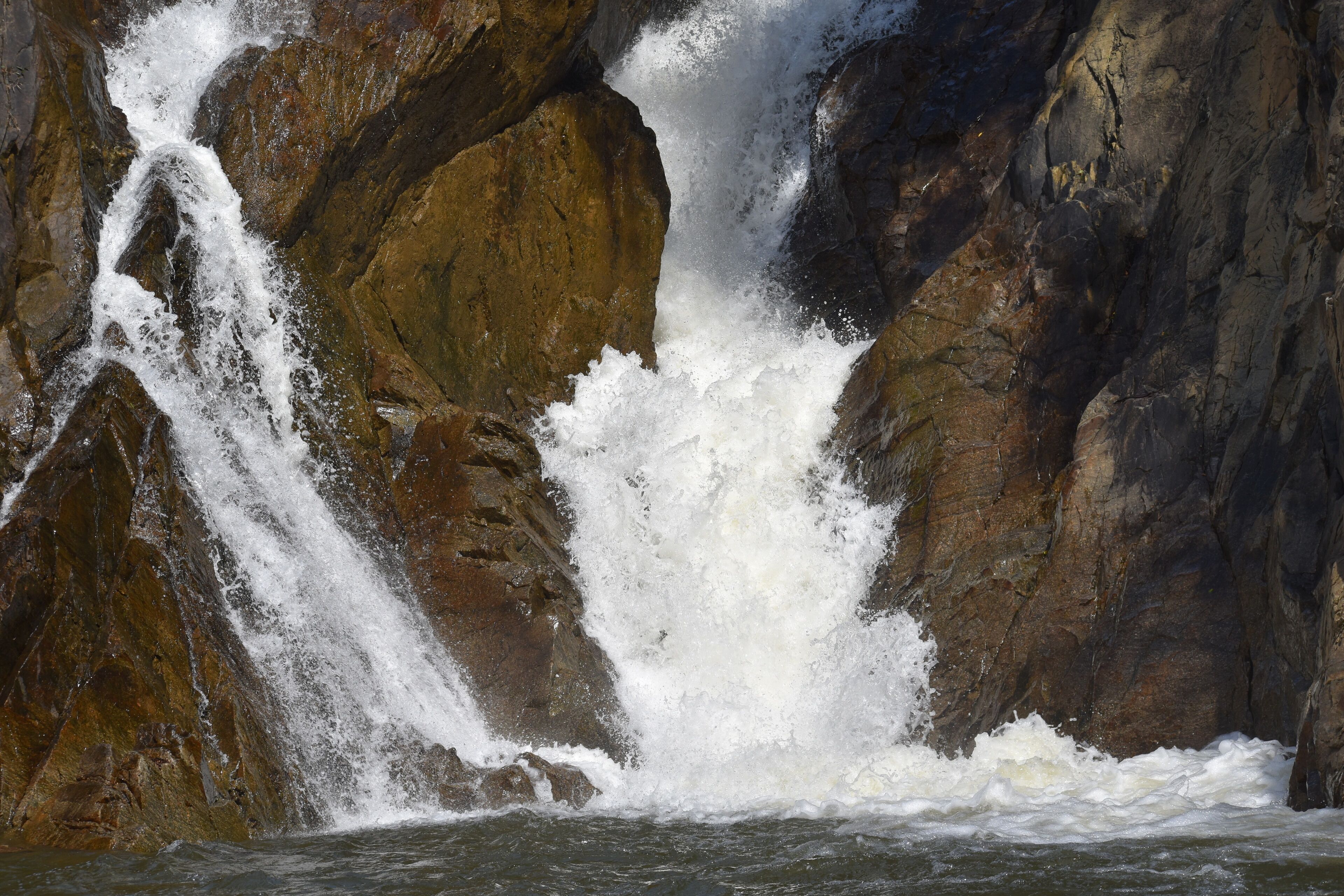 A waterfall cascading over rocky terrain.