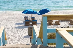 On the beach, sun-loungers