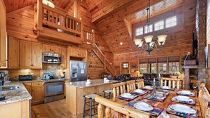 A spacious log cabin with a large kitchen, dining area, and a cozy living room. - Perfect Mountain Getaway with Amazing Views (Banner Elk)