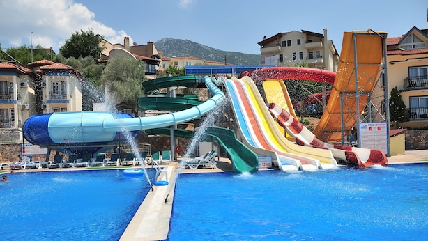 A water park with multiple slides and a pool. - Gurol Hotel & Apart (Fethiye)