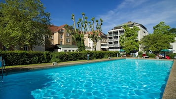 Seasonal outdoor pool, open 7:00 AM to 8:00 PM, pool loungers