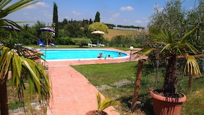 Seasonal outdoor pool, open 9:00 AM to 8:00 PM, pool umbrellas