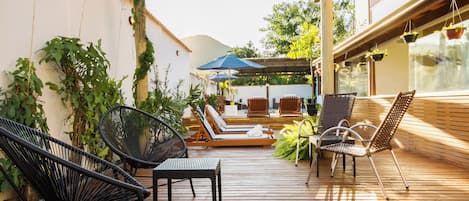 Outdoor pool, open 10:00 AM to 10:00 PM, pool umbrellas, sun loungers