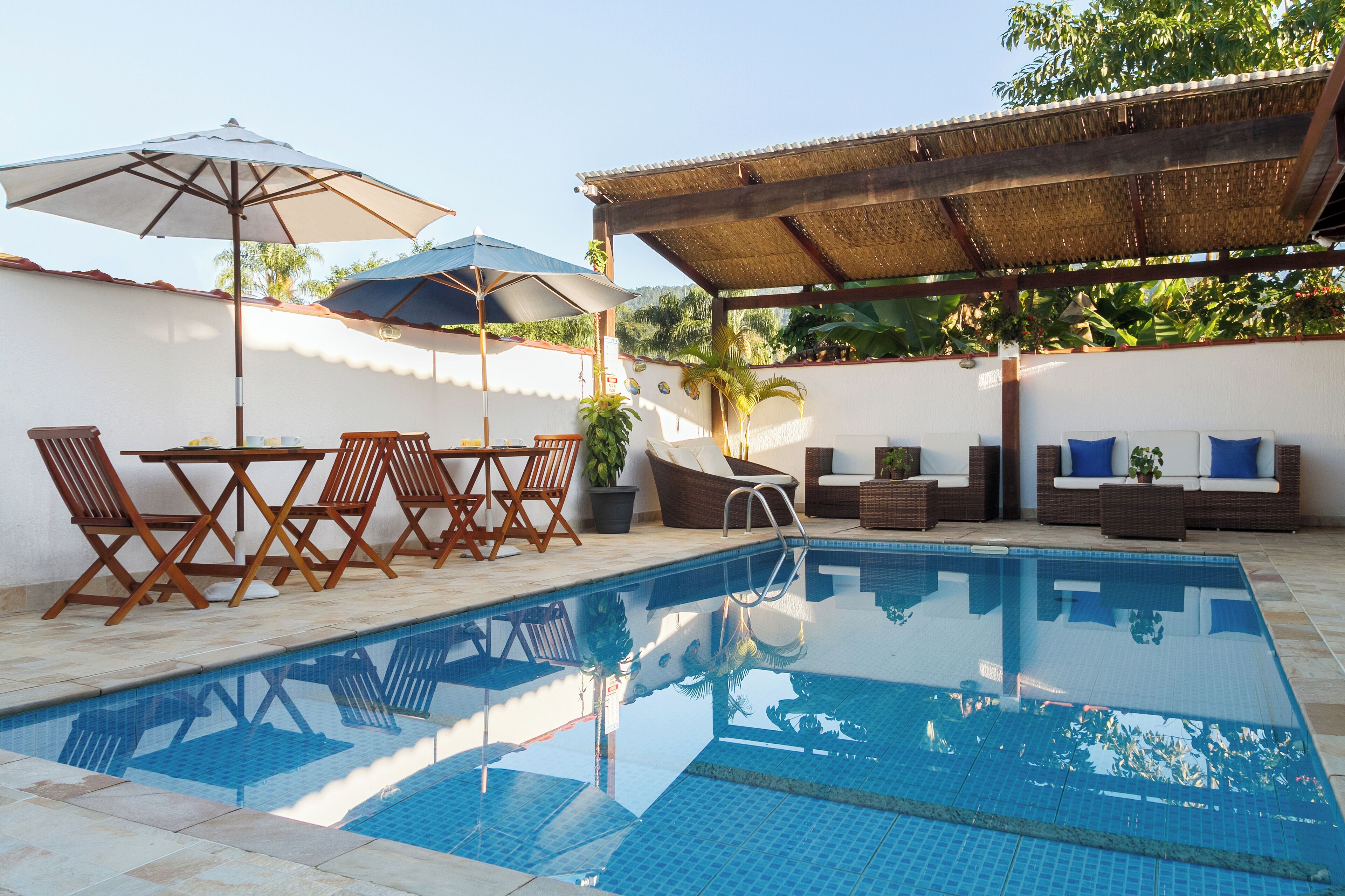 outdoor pool, open 10:00 am to 10:00 pm, pool umbrellas, pool loungers