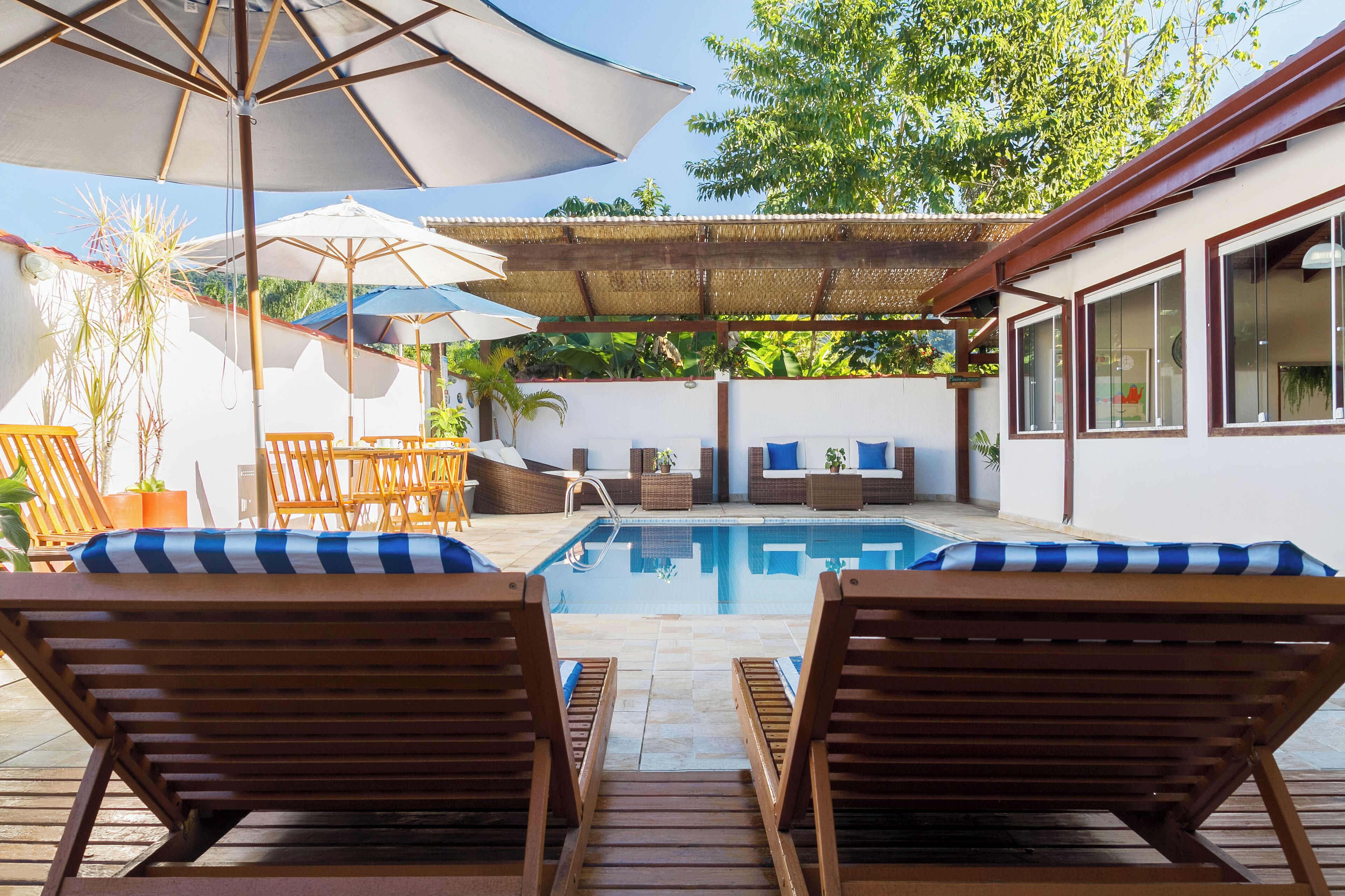 outdoor pool, open 10:00 am to 10:00 pm, pool umbrellas, pool loungers