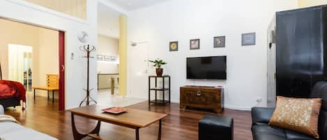 Premium Apartment, 1 Bedroom, Private Bathroom | Living room | Flat-screen TV