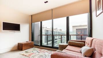 Premium Apartment, Balcony | Living room | 40-cm flat-screen TV with digital channels, TV