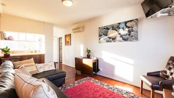 Basic Apartment, 1 Bedroom | Living room | 40-inch flat-screen TV with digital channels, TV