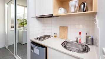 Basic Studio, Private Bathroom | Private kitchenette | Full-size fridge, microwave, stovetop, cookware/dishes/utensils