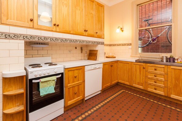 Enjoy cooking and dining in this well-equipped kitchen with a stove, oven, and dishwasher.
