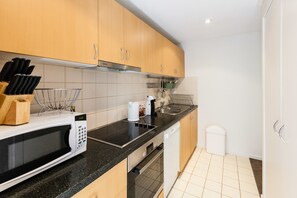 Premium Apartment, 2 Bedrooms | Private kitchen | Full-sized fridge, microwave, oven, stovetop