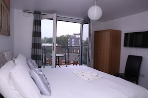 Premium bedding, laptop workspace, soundproofing, iron/ironing board