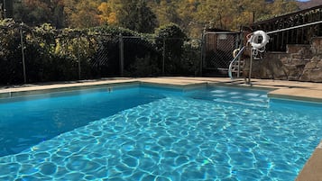 Outdoor pool, open 9:00 AM to 8:00 PM, pool loungers