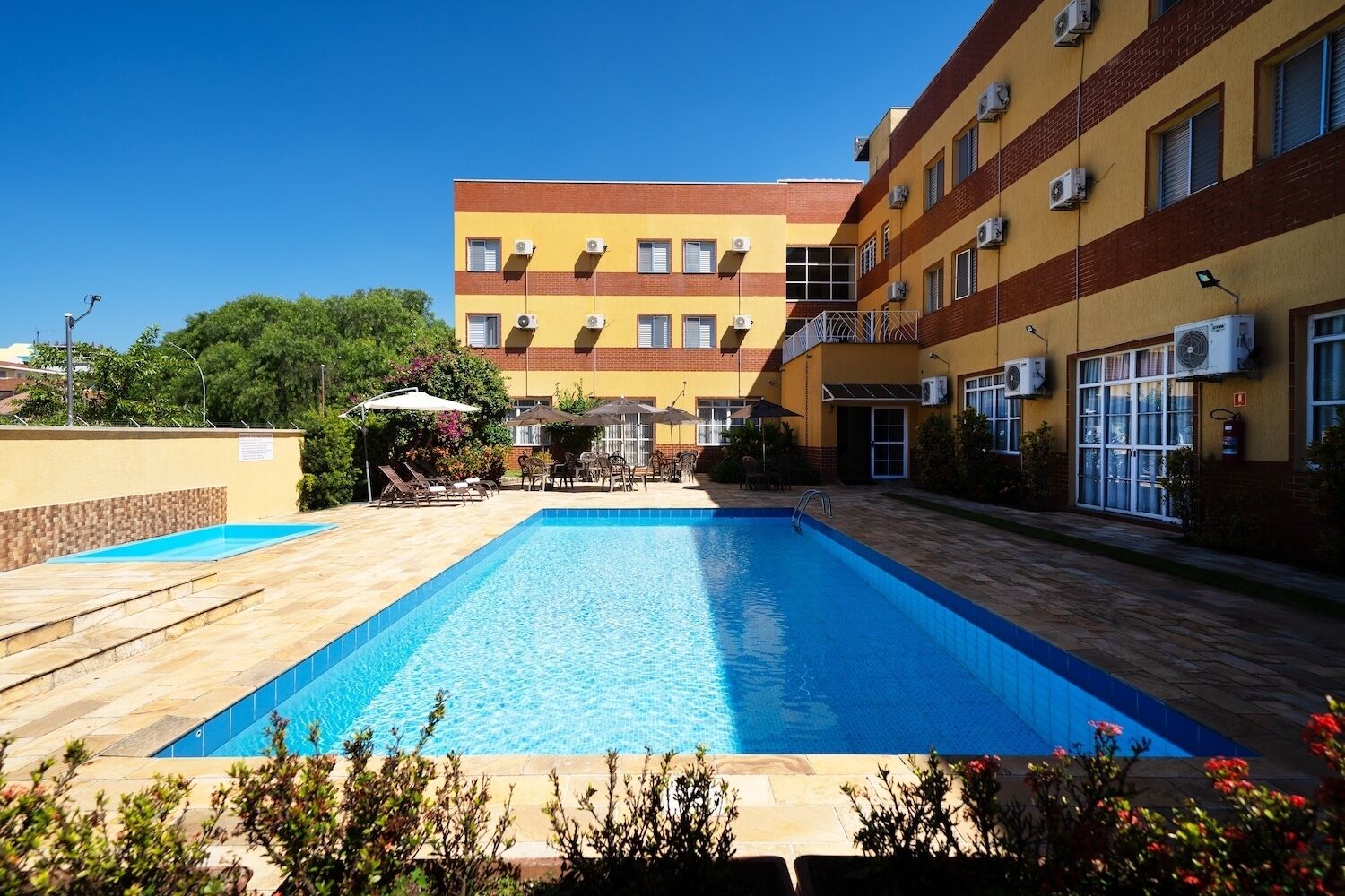 Outdoor pool, pool umbrellas, pool loungers