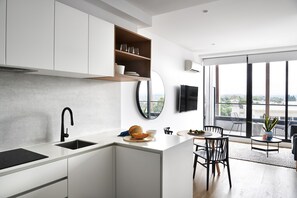 Superior One Bedroom Apartment | Private kitchen | Full-size fridge, microwave, oven, stovetop