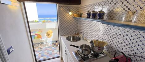 Fridge, stovetop, coffee/tea maker, cookware/dishes/utensils