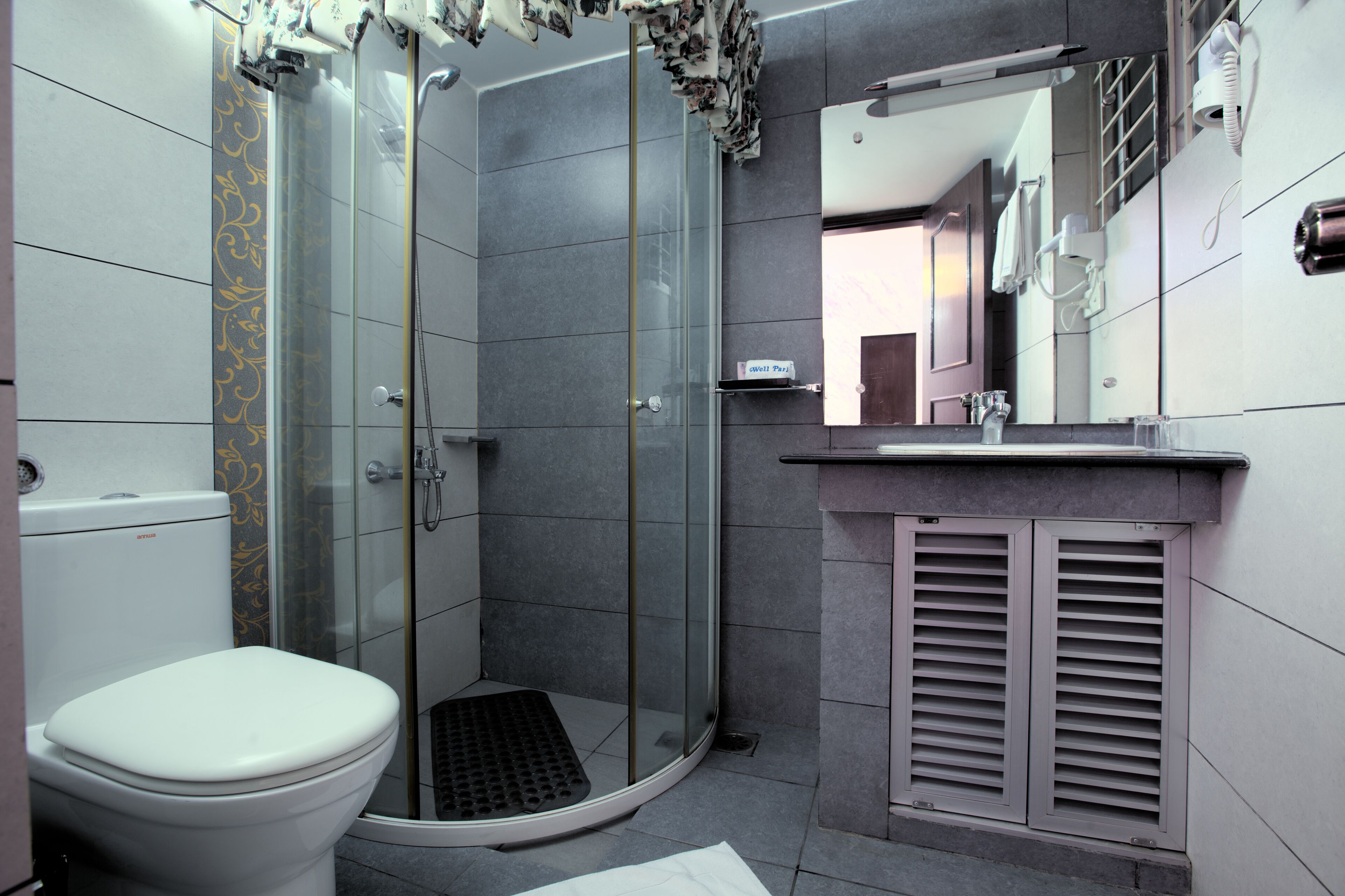 Shower, free toiletries, slippers, towels