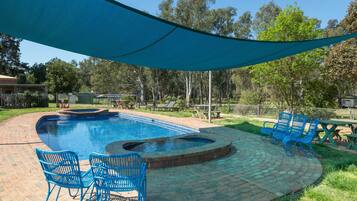 Outdoor pool, open 8:30 AM to 8:30 PM, pool umbrellas, pool loungers
