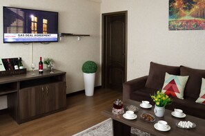 Standard Double Room | Living area | Plasma TV, pay movies, heated floors