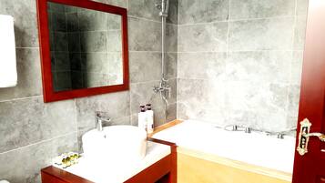 Combined shower/tub, free toiletries, hair dryer, slippers
