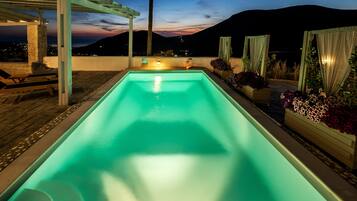 Outdoor pool, pool umbrellas, pool loungers