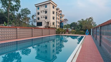 Outdoor pool, open 7:00 AM to 11:30 PM, pool loungers