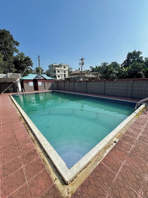 Outdoor pool, open 7:00 AM to 11:30 PM, sun loungers