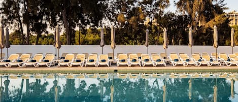 Indoor pool, 2 outdoor pools, open 8:00 AM to 8:00 PM, pool umbrellas