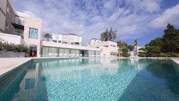 Indoor pool, 2 outdoor pools, open 8:00 AM to 8:00 PM, pool umbrellas