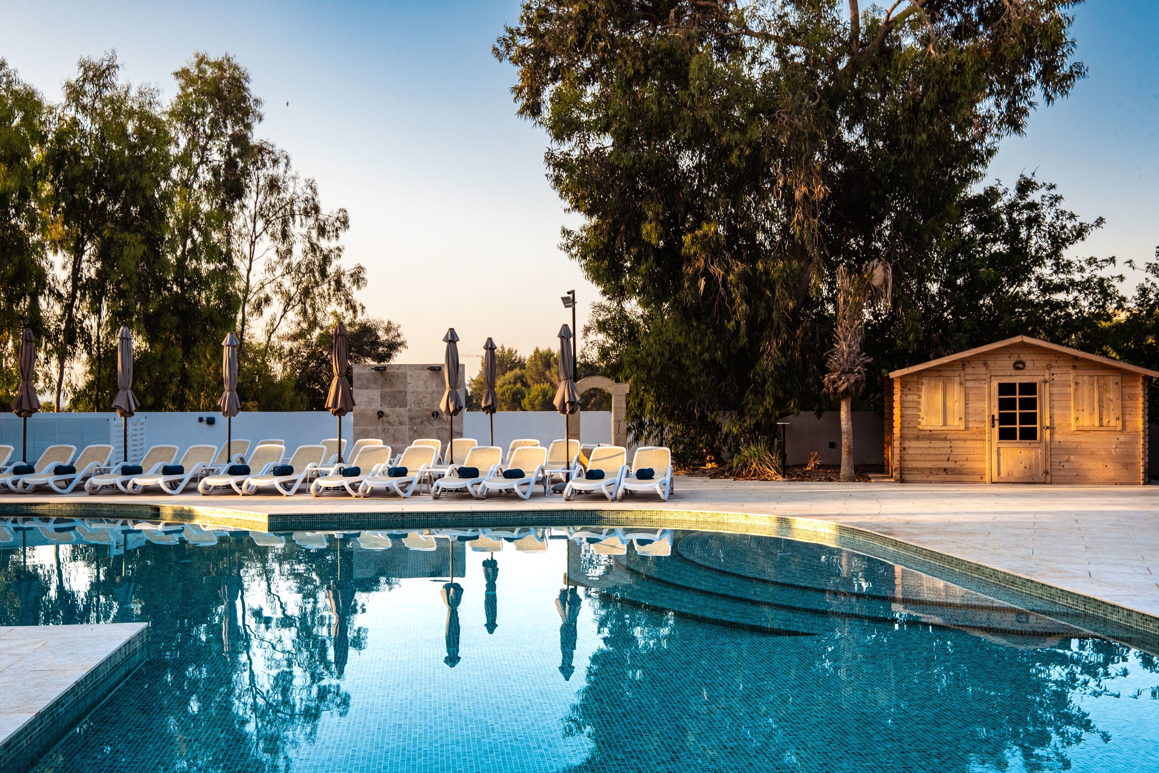 indoor pool, 2 outdoor pools, open 8:00 am to 8:00 pm, pool umbrellas