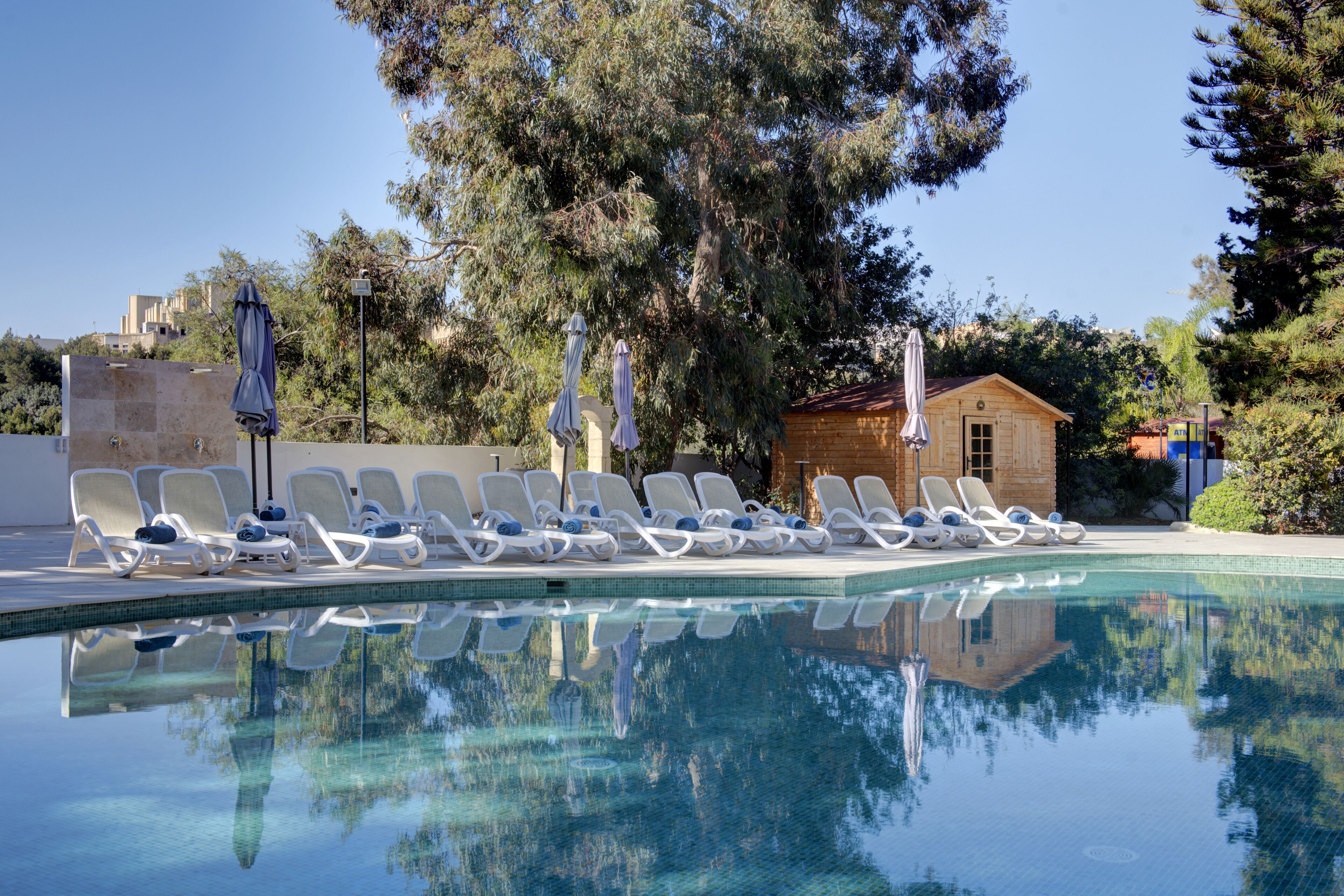 indoor pool, 2 outdoor pools, open 8:00 am to 8:00 pm, pool umbrellas