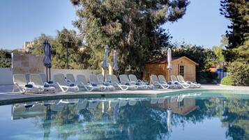Indoor pool, 2 outdoor pools, open 8:00 AM to 8:00 PM, pool umbrellas