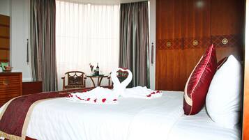 Junior Suite, City View | Pillowtop beds, minibar, in-room safe, desk