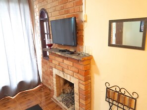 Standard-Studiosuite, 1 Schlafzimmer, Kamin | Wohnbereich
