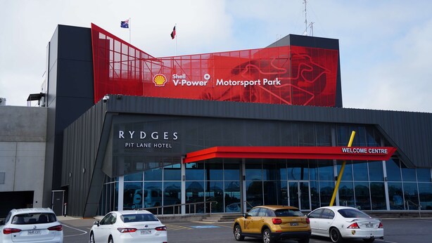 A hotel with a large red advertisement for Shell V-Power Motorsport Park.