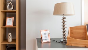 A wooden shelf with decorative items and a framed sign that reads "be KIND." - ByEvo 1 Brabloch GLA Apartment  (Paisley)