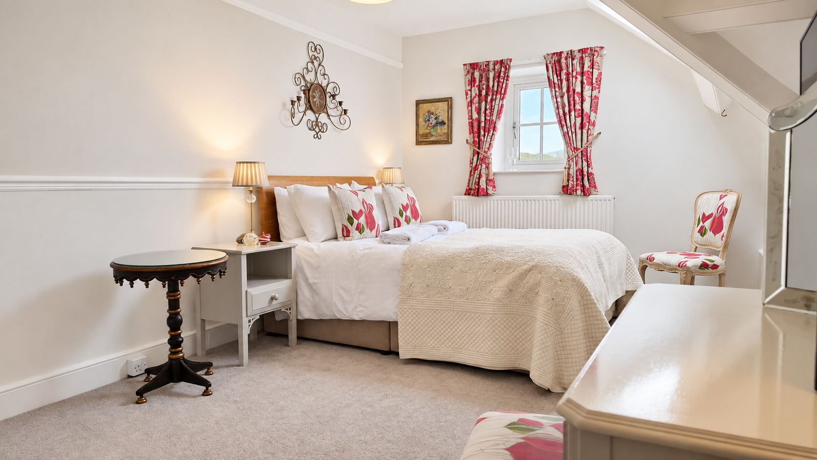 A bedroom with a bed, bedside tables, a chair, a window with curtains, and a wall clock.